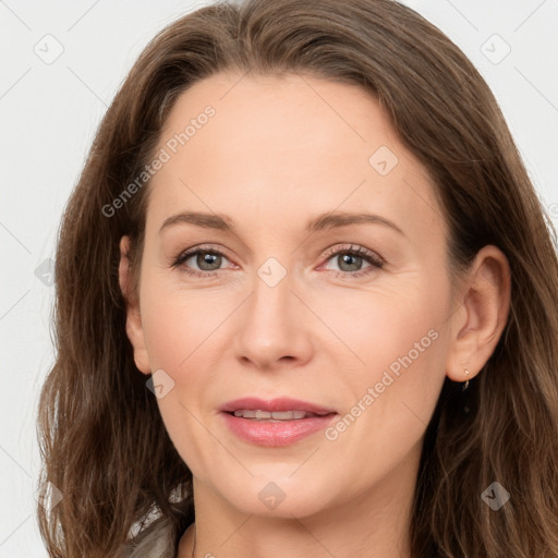 Joyful white adult female with long  brown hair and brown eyes