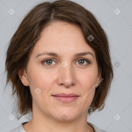 Joyful white young-adult female with medium  brown hair and green eyes