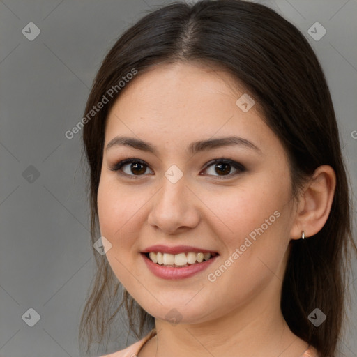 Joyful white young-adult female with medium  brown hair and brown eyes