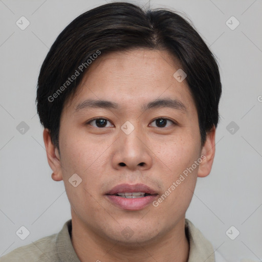 Joyful asian young-adult male with short  brown hair and brown eyes