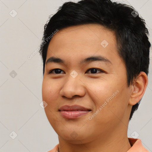 Joyful asian young-adult male with short  brown hair and brown eyes