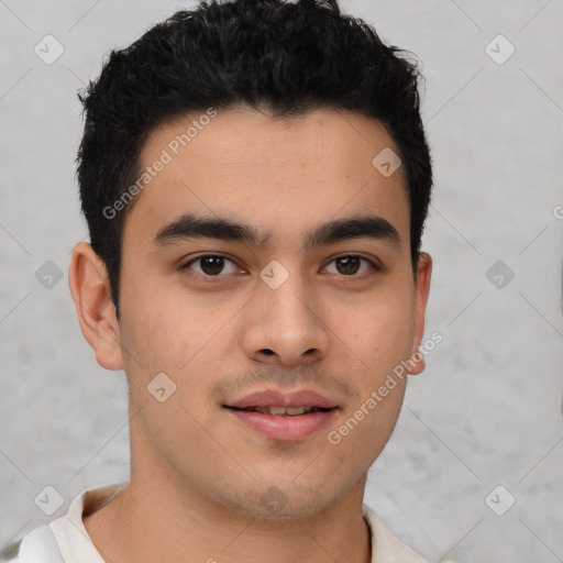 Joyful latino young-adult male with short  brown hair and brown eyes