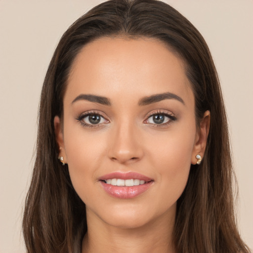 Joyful white young-adult female with long  brown hair and brown eyes