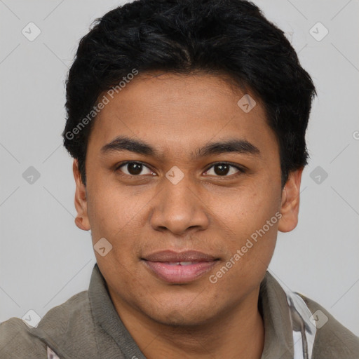 Joyful latino young-adult male with short  brown hair and brown eyes