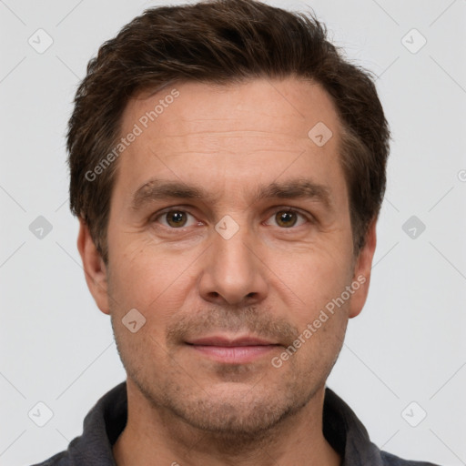 Joyful white adult male with short  brown hair and grey eyes