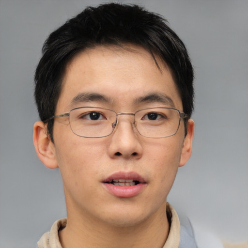 Neutral asian young-adult male with short  brown hair and brown eyes