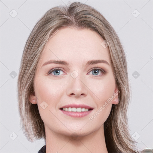 Joyful white young-adult female with medium  brown hair and blue eyes