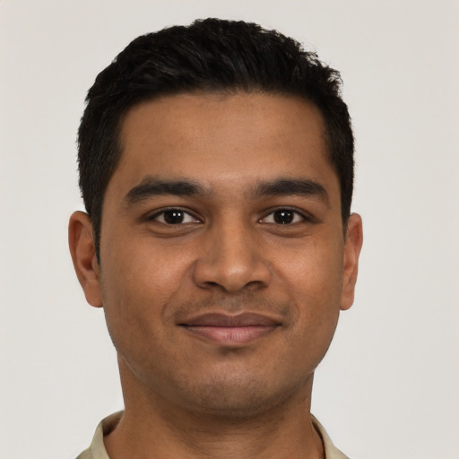 Joyful latino young-adult male with short  black hair and brown eyes