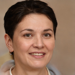 Joyful white adult female with short  brown hair and brown eyes