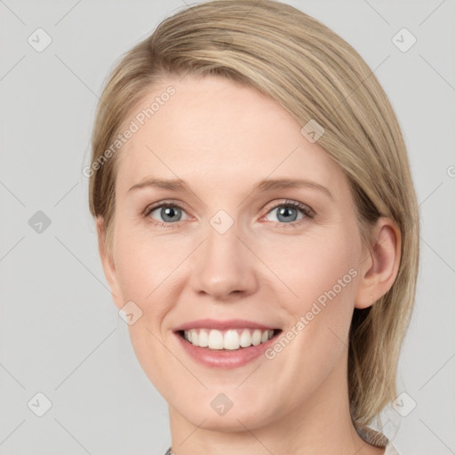 Joyful white young-adult female with medium  brown hair and blue eyes