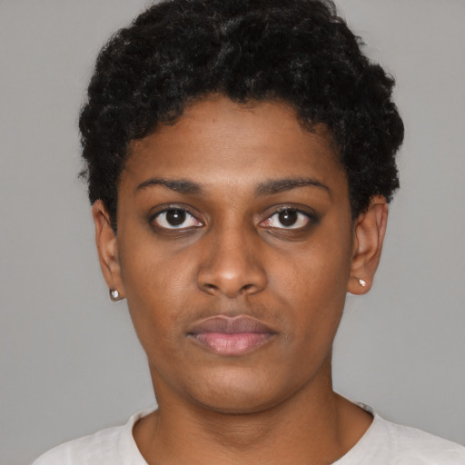 Neutral black young-adult female with short  black hair and brown eyes