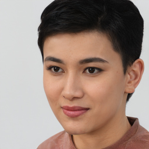 Joyful asian young-adult female with short  black hair and brown eyes