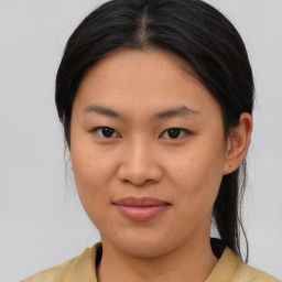 Joyful asian young-adult female with medium  brown hair and brown eyes