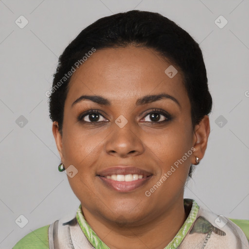 Joyful black young-adult female with short  black hair and brown eyes