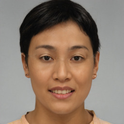 Joyful asian young-adult female with short  brown hair and brown eyes