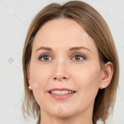 Joyful white young-adult female with medium  brown hair and grey eyes