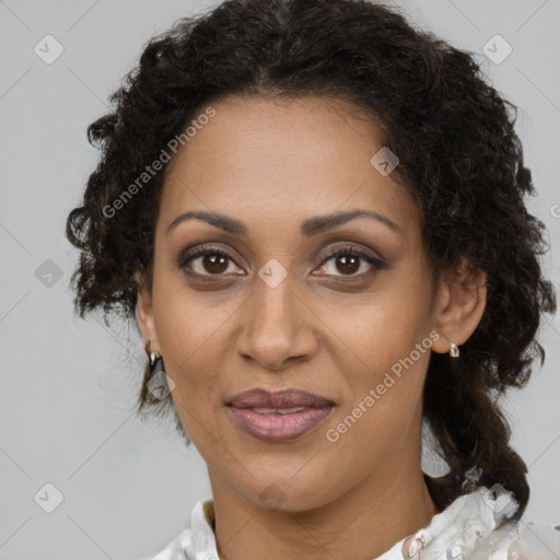 Joyful black adult female with medium  brown hair and brown eyes