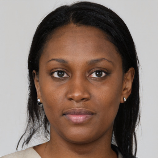 Neutral black young-adult female with medium  brown hair and brown eyes