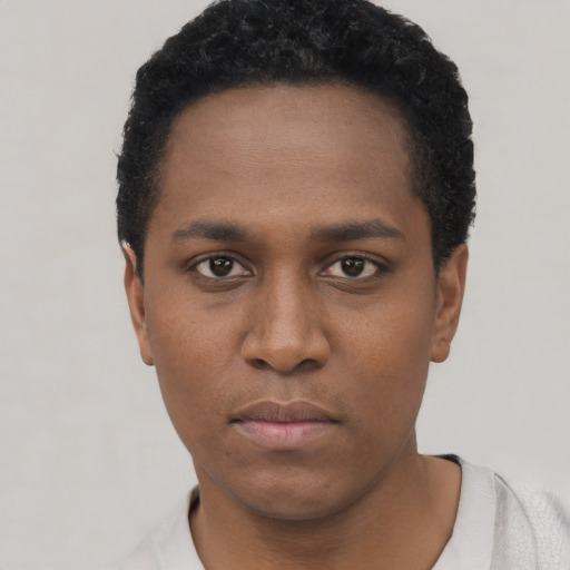 Neutral black young-adult male with short  black hair and brown eyes