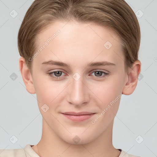 Joyful white young-adult female with short  brown hair and grey eyes