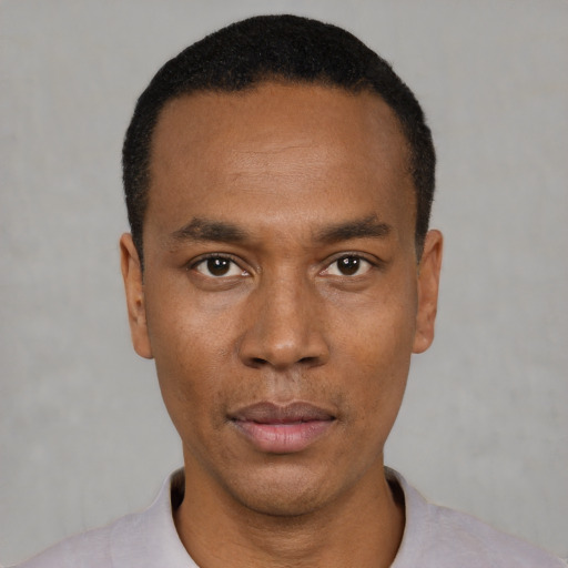 Neutral black young-adult male with short  black hair and brown eyes