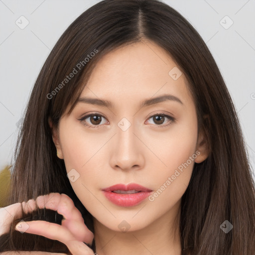 Neutral white young-adult female with long  brown hair and brown eyes