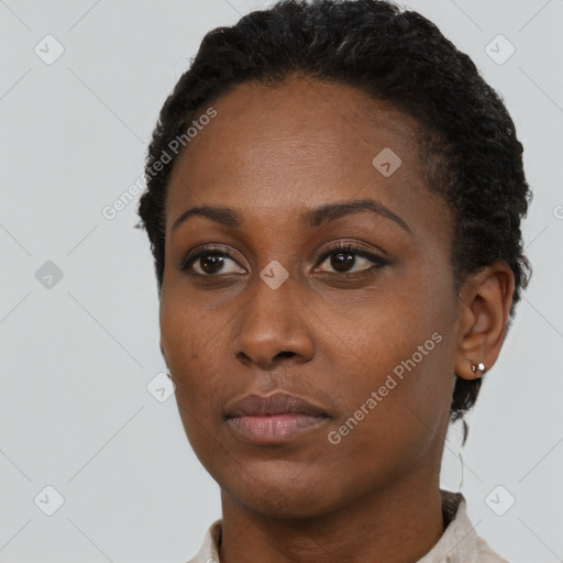 Neutral black young-adult female with short  black hair and brown eyes