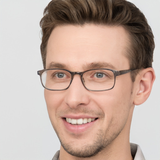 Joyful white young-adult male with short  brown hair and grey eyes