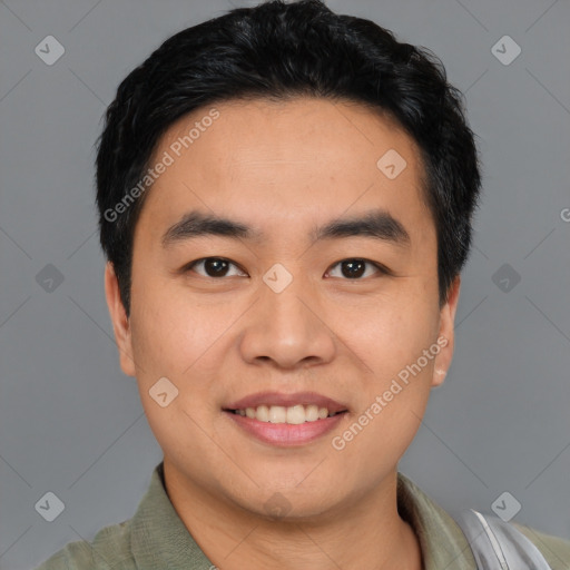 Joyful asian young-adult male with short  black hair and brown eyes