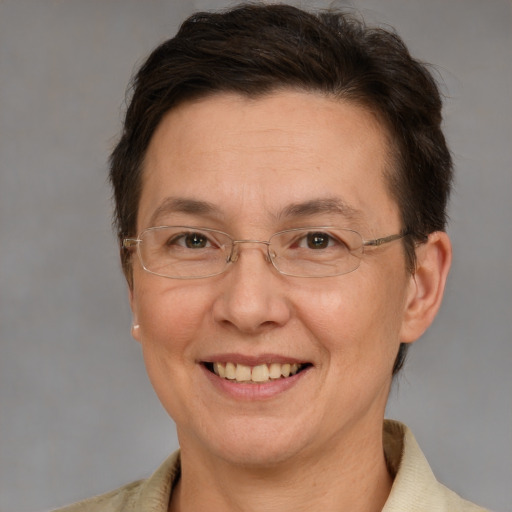 Joyful white adult female with short  brown hair and grey eyes