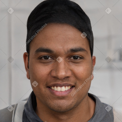 Joyful latino young-adult male with short  black hair and brown eyes