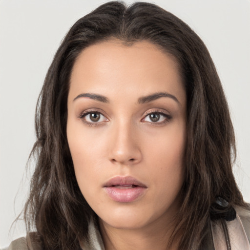 Neutral white young-adult female with long  brown hair and brown eyes