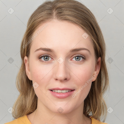 Joyful white young-adult female with medium  brown hair and blue eyes