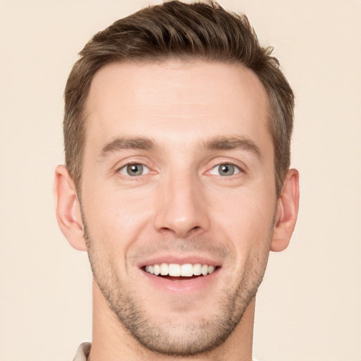 Joyful white young-adult male with short  brown hair and brown eyes