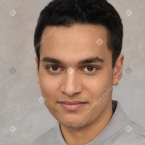 Joyful white young-adult male with short  black hair and brown eyes