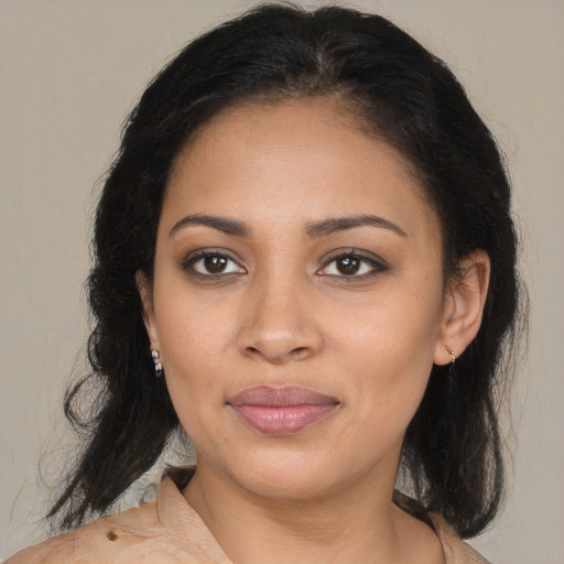 Joyful latino young-adult female with medium  brown hair and brown eyes