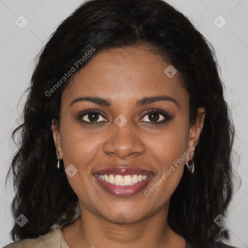 Joyful black young-adult female with long  brown hair and brown eyes