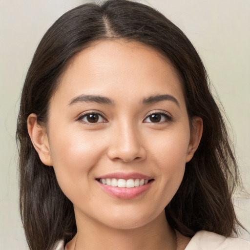 Joyful white young-adult female with medium  brown hair and brown eyes