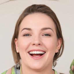 Joyful white young-adult female with medium  brown hair and green eyes