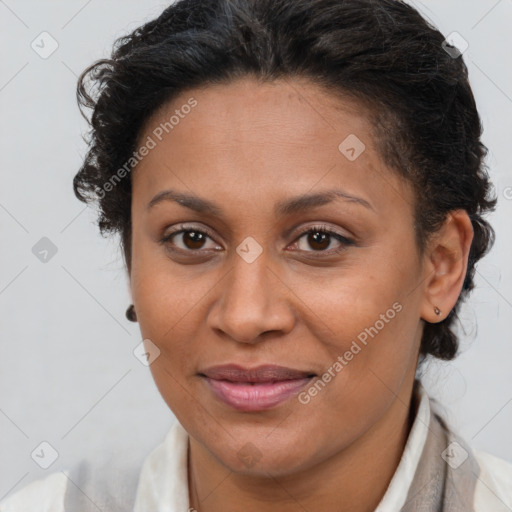 Joyful latino adult female with short  brown hair and brown eyes