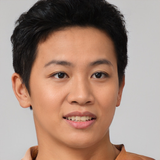 Joyful asian young-adult female with short  brown hair and brown eyes