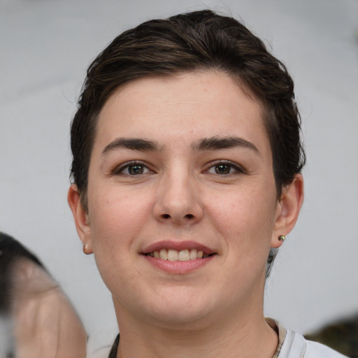 Joyful white young-adult female with short  brown hair and brown eyes