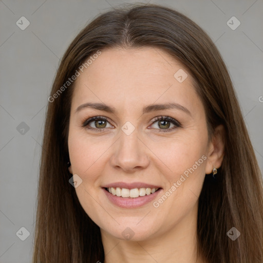 Joyful white adult female with long  brown hair and brown eyes