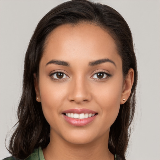 Joyful white young-adult female with long  brown hair and brown eyes