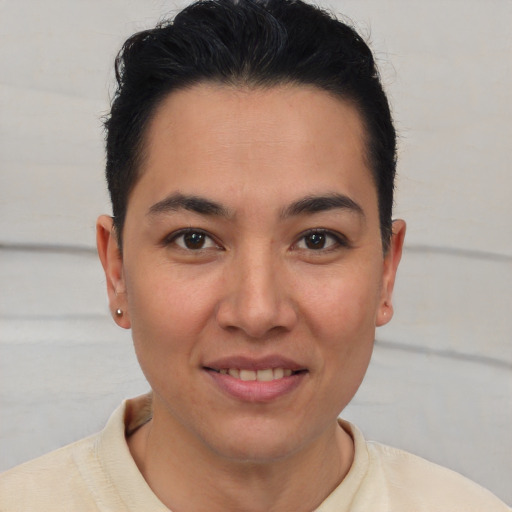 Joyful latino young-adult female with short  brown hair and brown eyes