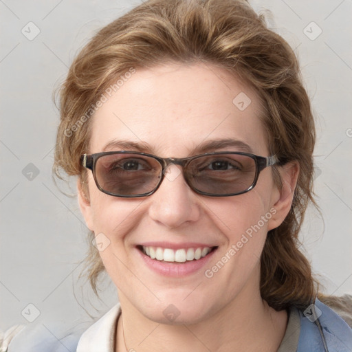 Joyful white young-adult female with medium  brown hair and blue eyes