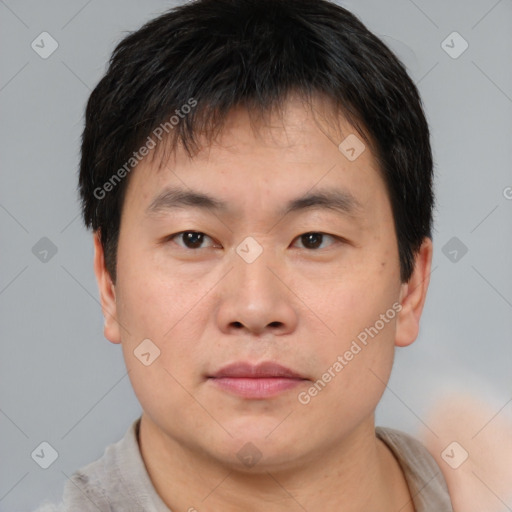 Neutral asian young-adult male with short  brown hair and brown eyes