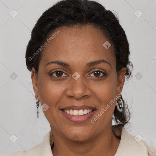 Joyful black adult female with short  brown hair and brown eyes