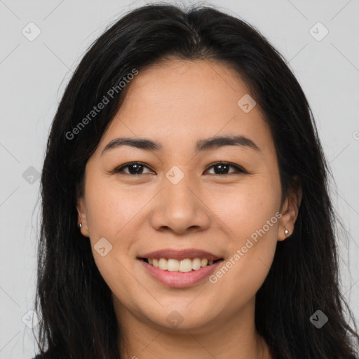 Joyful latino young-adult female with long  brown hair and brown eyes