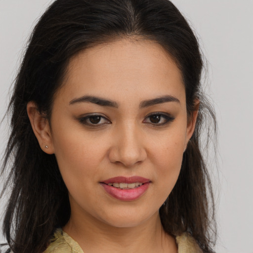 Joyful white young-adult female with long  brown hair and brown eyes